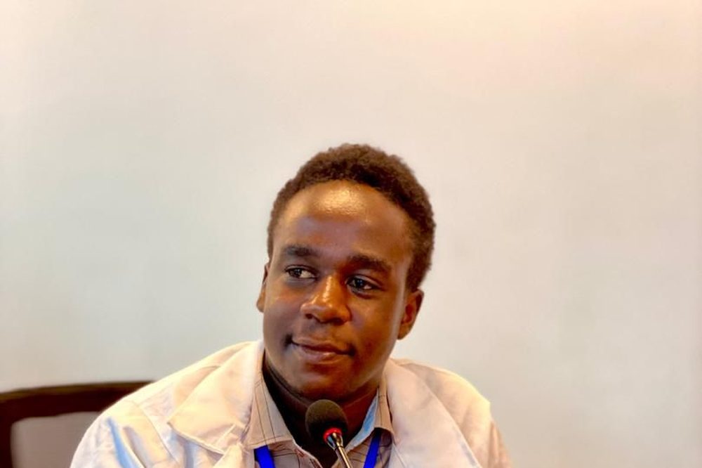Valence Mwigani speaking at a programme event